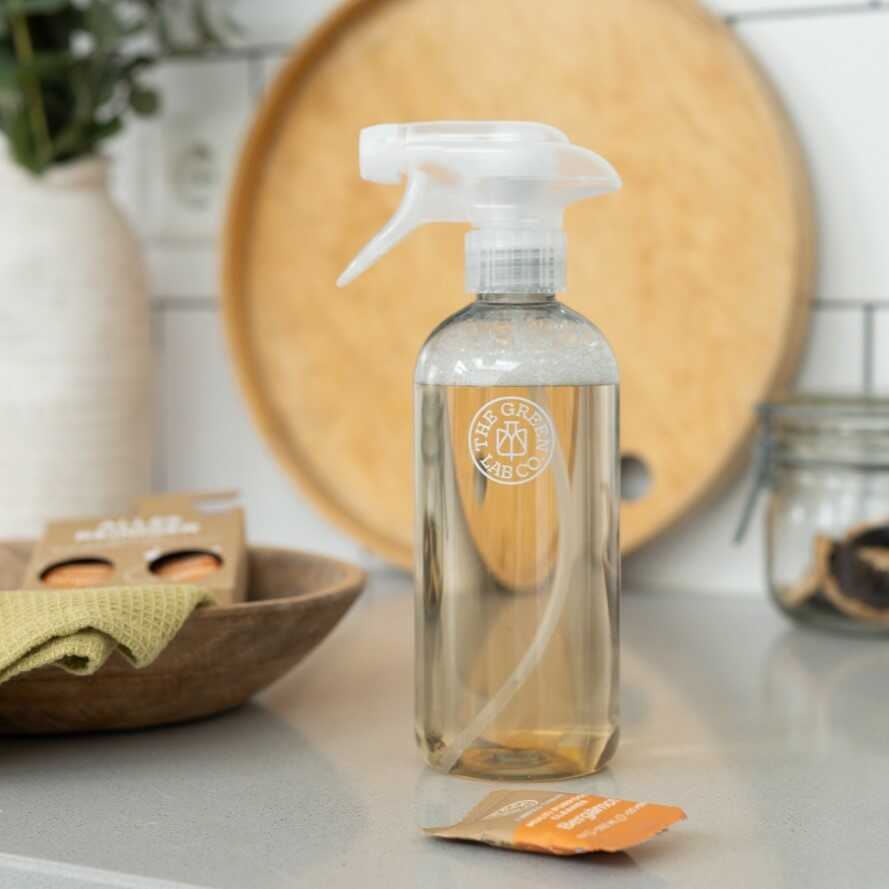 Eco-friendly multi-purpose cleaning tablets with bergamot scent by The Green Lab Co – pack of 3 refills shown with white tablets, dried citrus and cleaning cloth on a neutral background.